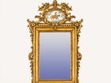 a gold frame with a picture of a horse on it