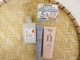 three different types of skin care products on a wicker tray