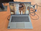 a laptop that is sitting on a desk with a mouse