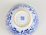 blue and white porcelain vase with floral design on the rim