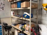 a room with a lot of tools on the shelves