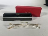 glasses are sitting on a table next to a box and a pair of glasses