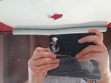 a man that is taking a picture of himself in the mirror