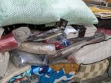 a pile of bedding and pillows in a store
