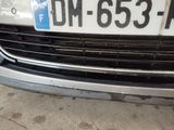 a close up of the front of a car with a license plate on it