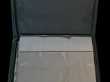 a open suitcase that is sitting on a black surface