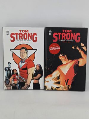 two comics are sitting on a table next to each other