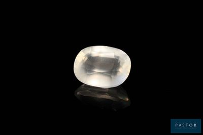 a white quartz stone on a black surface