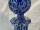 a blue and white vase sitting on a table