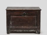 an old wooden chest with a drawer on top of it
