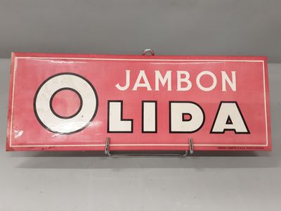 un gros plan d'une enseigne sur laquelle on peut lire « jambon olida »