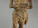 an image of a statue of a man holding a knife