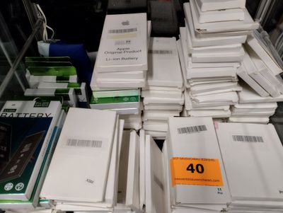 many books stacked on top of each other on a table