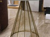 a glass table with a gold metal base and a glass top