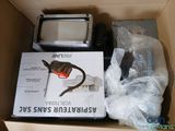 a box with a microwave and other items inside of it