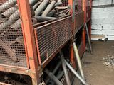 a pile of pipes and pipes in a storage area