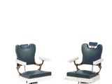 pair of blue and white barber chairs against a white background