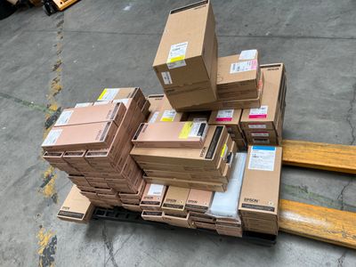 a pile of boxes sitting on a pallet in a warehouse