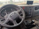 dashboard of a truck with a steering wheel and dashboard controls