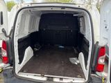 a white van with the back door open and the back door open