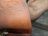a close up of a person ' s foot with a shoe on it