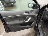a car door open with a broken glass on it