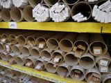 many rolls of toilet paper on the shelves in the store