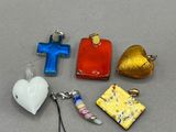 four different pieces of glass with a cross, a heart, and a cross on it
