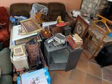 a living room with a lot of boxes and boxes on the floor