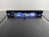 a close up of a car ' s license plate with a blue light on it