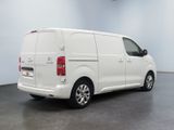 a picture of a white van parked in a room