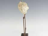 an image of a sculpture of a bird on a branch