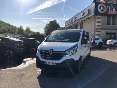a white van that is parked in front of a building