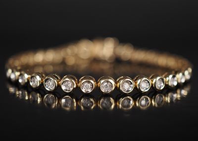Bracelet tennis en or jaune 14 carats serti de diamants