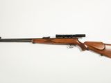 a rifle on a white background