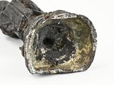 a close up of a metal object on a white surface
