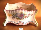 a small bowl with a floral design on it on a table