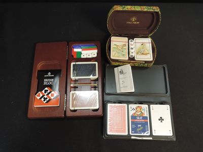 a box of cards and a case of playing cards on a table