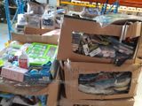 several boxes of assorted items are stacked on top of each other in a warehouse
