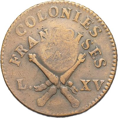 a close up of a coin with a skull and crossbones on it