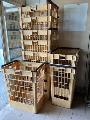 many crates stacked on top of each other in a room