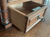 a drawer that has a book in it on the floor