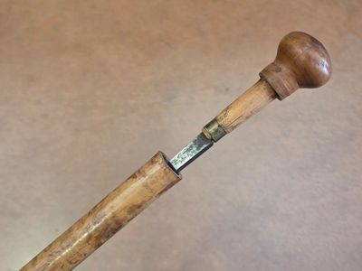 a baseball bat with a wooden handle on a table