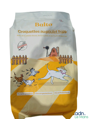 a bag of dog food that is on the ground