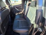 the back seats of a car are empty in a parking lot