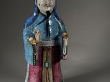 an image of a figurine of a woman with a bird in her hand