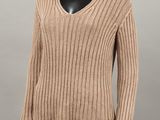 a woman ' s sweater with a v - neck and long sleeves on a mannequin mannequin mannequin mannequin mannequin manne