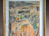tableau représentant un paysage, dans un cadre doré, posé sur une surface blanche