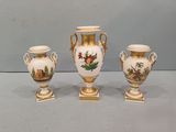 three vases that are sitting on a table