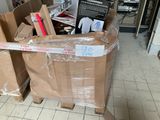 a large pile of boxes in the middle of the floor